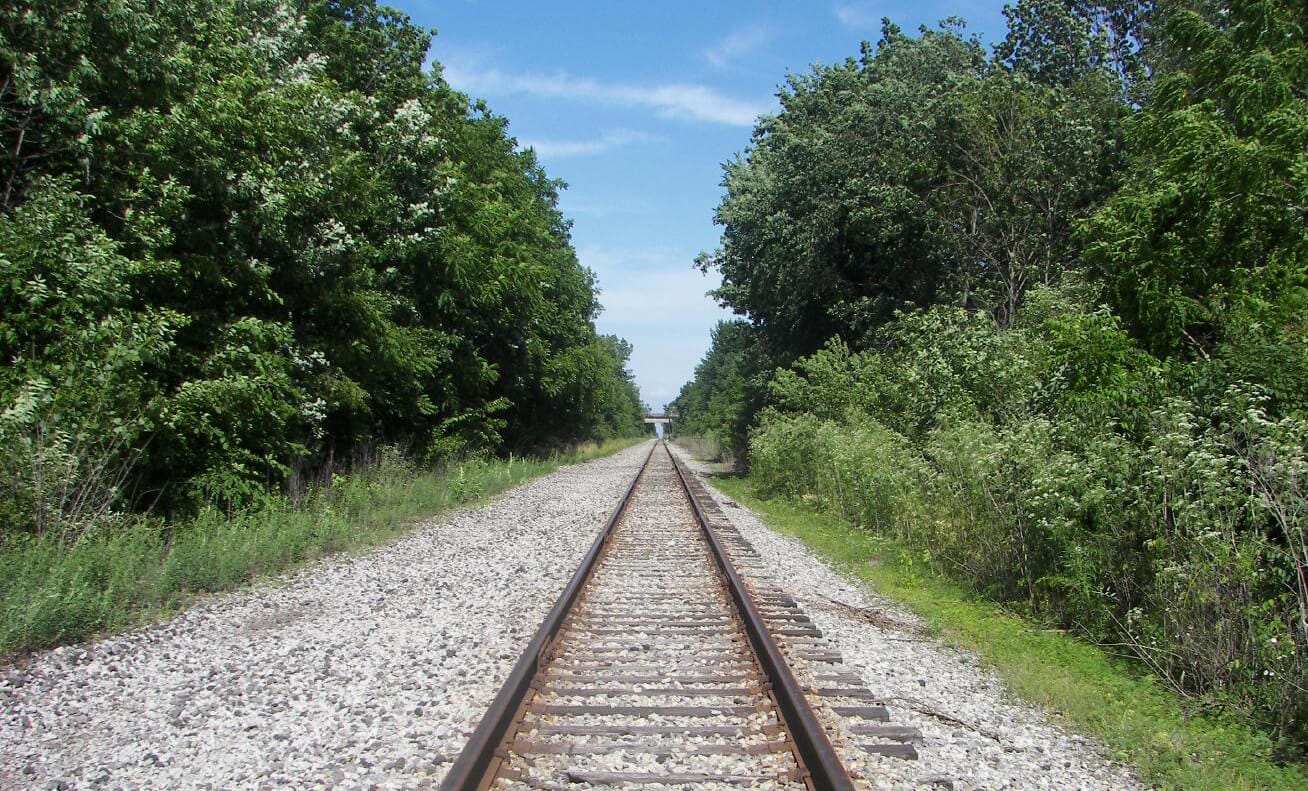 Rail road tracks seen in perspective where the convergence effect is 