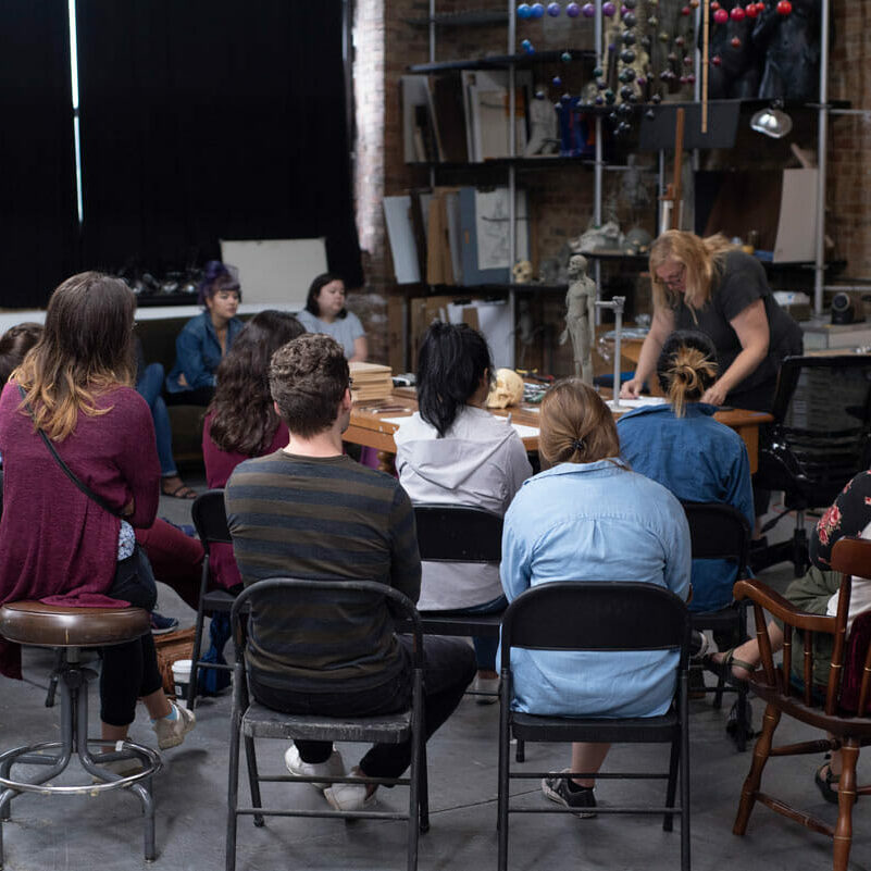 BVIS-demo Vitruvian instructor Melinda Whitmore working with a group of biomedical visualization students.